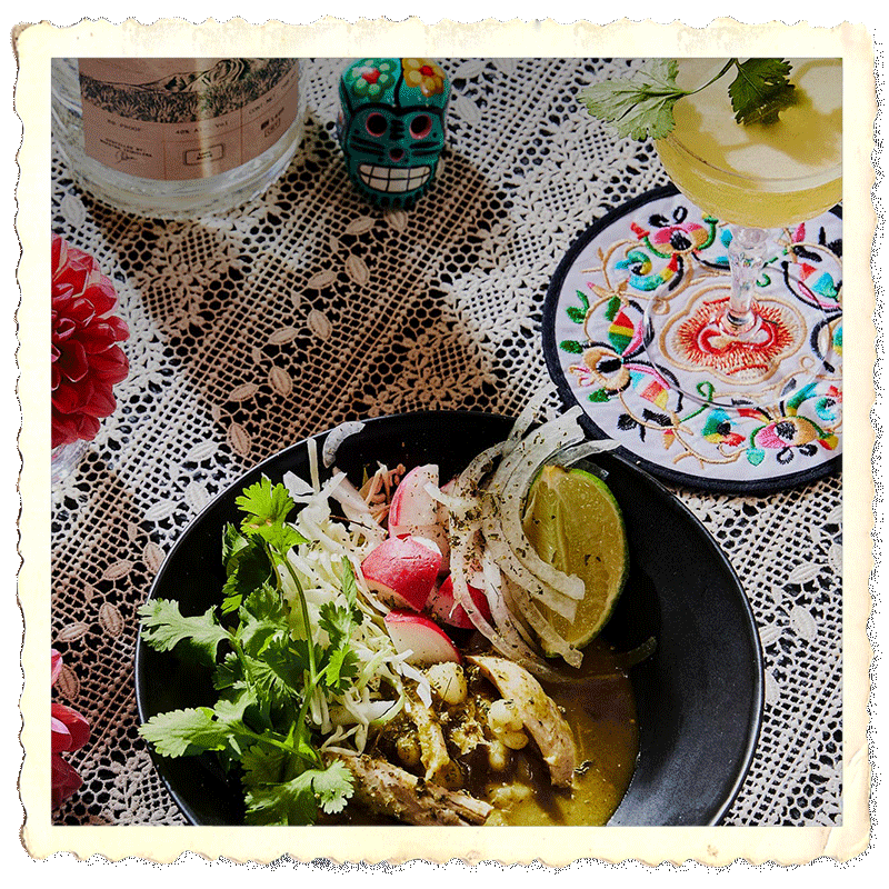 Prepared plate with pozole verde, a cocktail glass and a Mijenta Tequila Blanco bottle