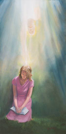 A young woman kneeling with the scriptures in her lap. Light is shining down on her. 