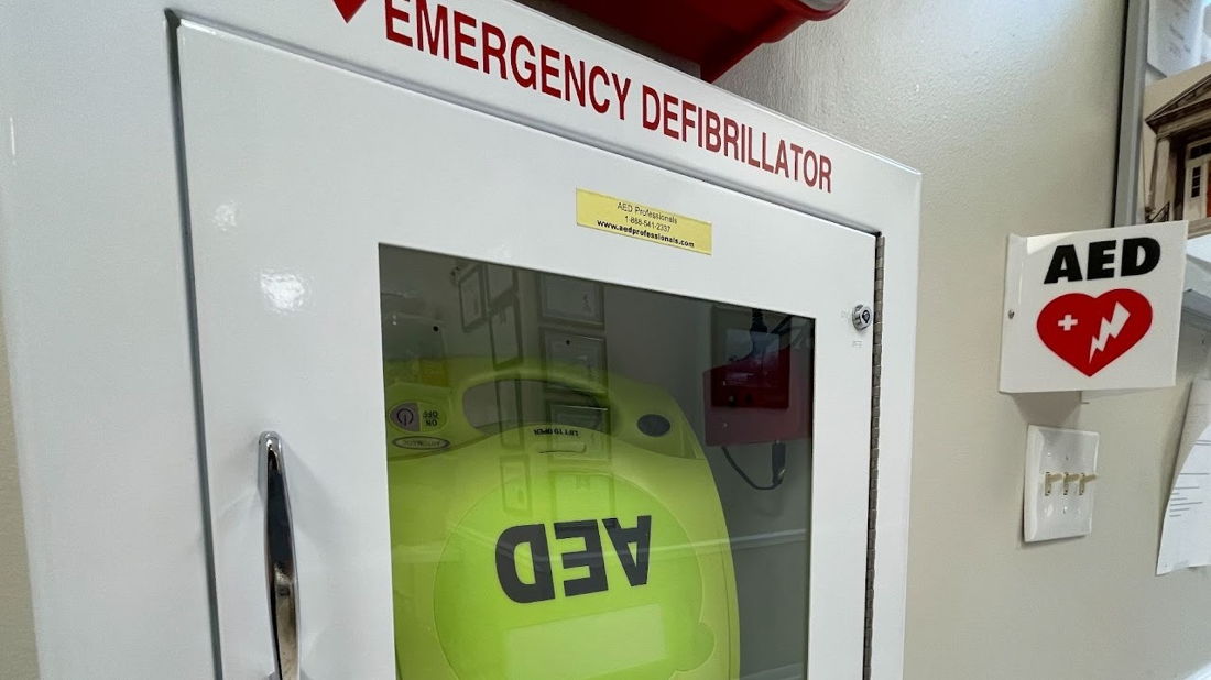 AED in a wall cabinet, ready for emergency use