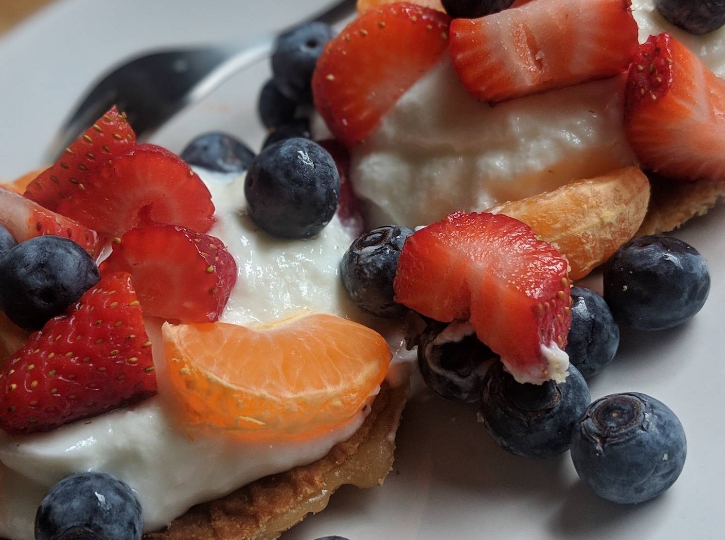 Photo of stroopwafel with fruits and yoghurt