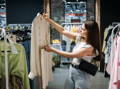 conscious buyer in clothing store