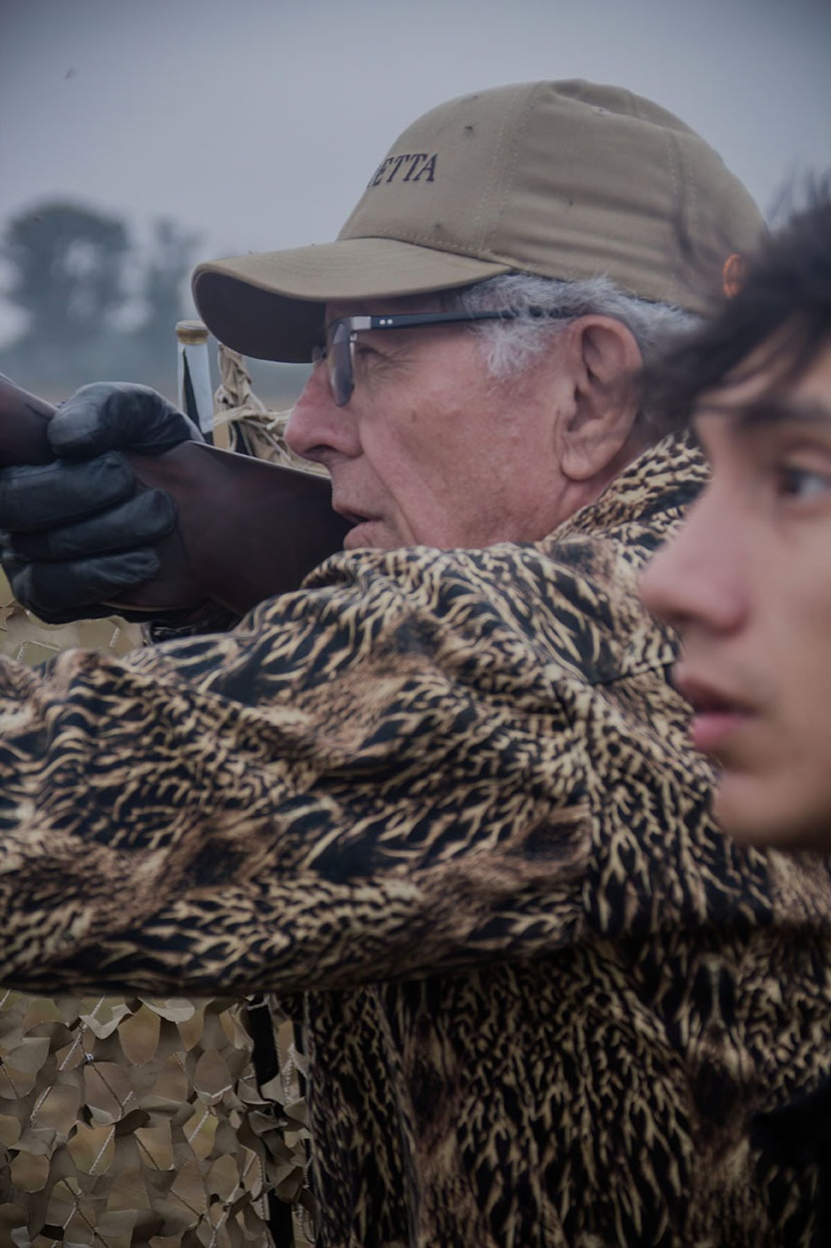 Two hunters shooting a fast dove flight