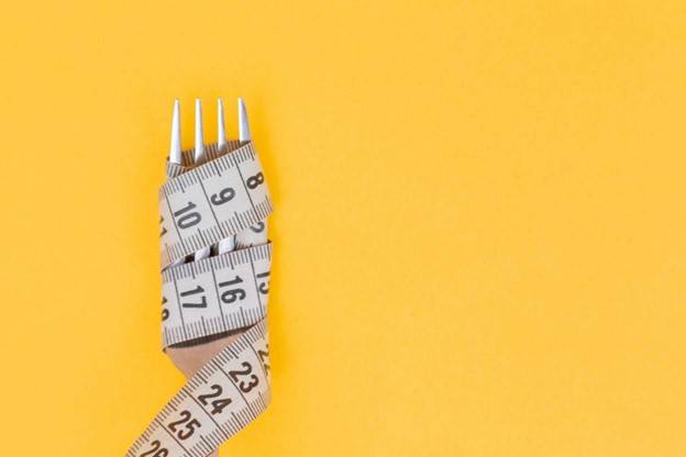 For wrapped in measuring tape: how to stop dieting.