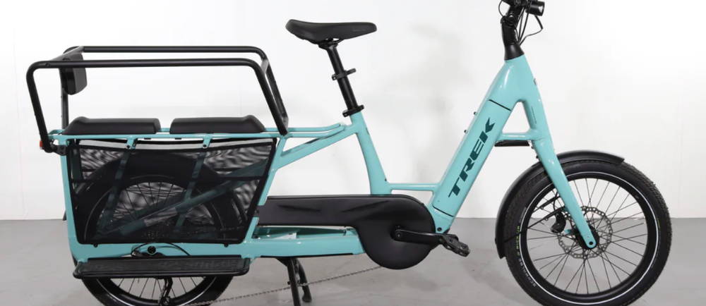 a green Trek Fetch+ 2 electric cargo bike
