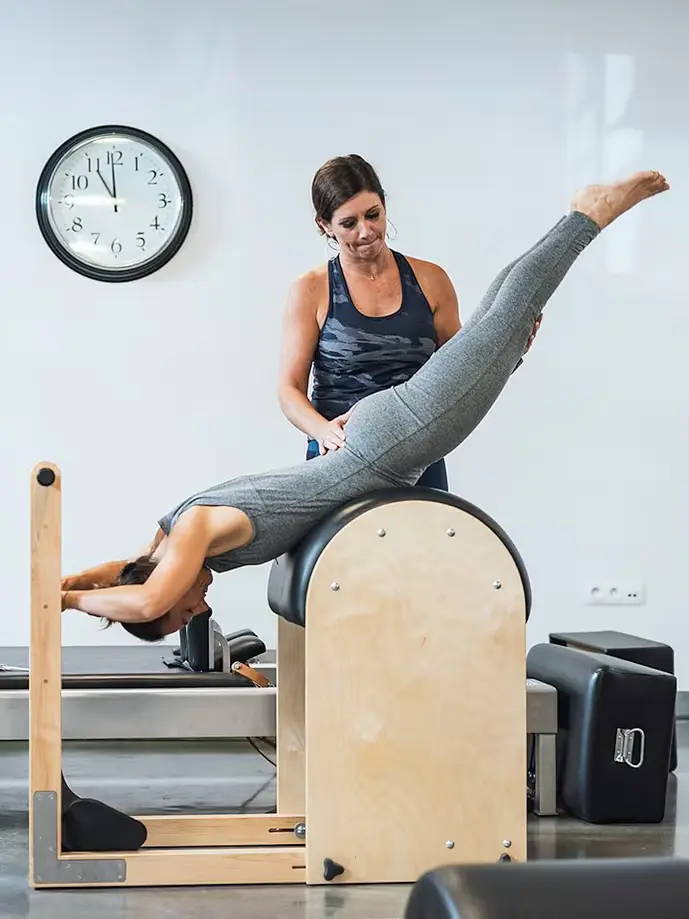 Photo of Dana teaching student on ladder barrel 