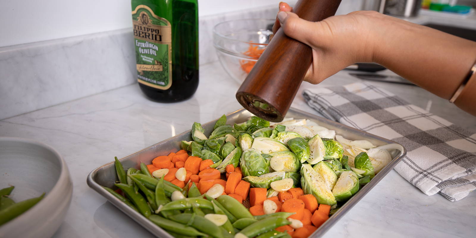 Healthy vegetable sheet pan recipe seasoned with salt and pepper and drizzled with olive oil.