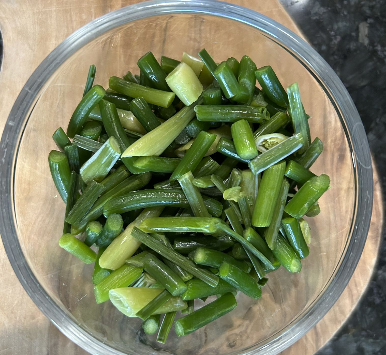 Chopped up garlic scapes in a bowl