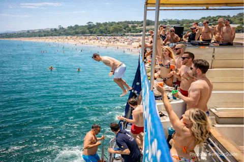 Boat Party to the Beach with Swimming Stops, DJ and Open Bar