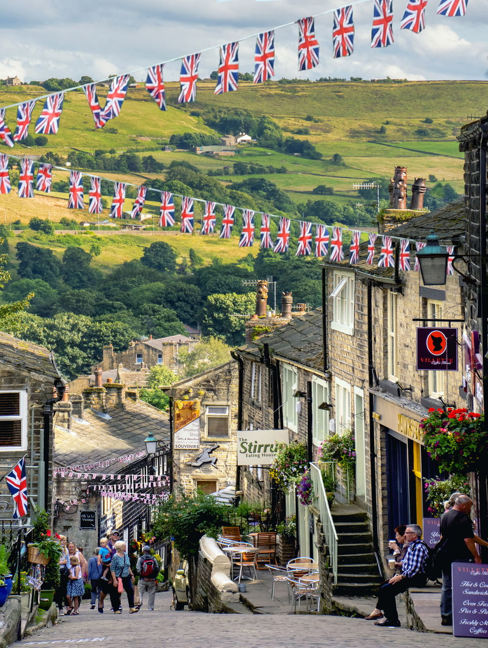 View down the cobbled hill in the village of Haworth, West Yorkshire, England.