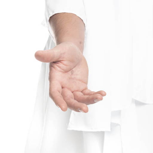 Up close photo of Jesus' extended hand against a white robe.