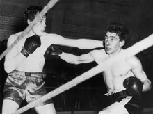 Ronnie (right), boxing as a young man at the Albert Hall, London, England.