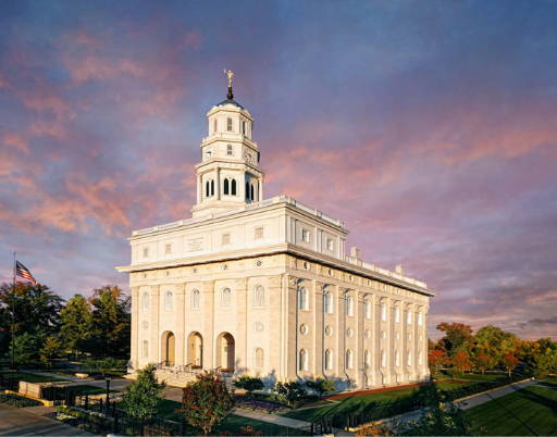 Nauvoo Temple against a deep blue sky.