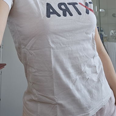 white t-shirt with print "EXTRA"