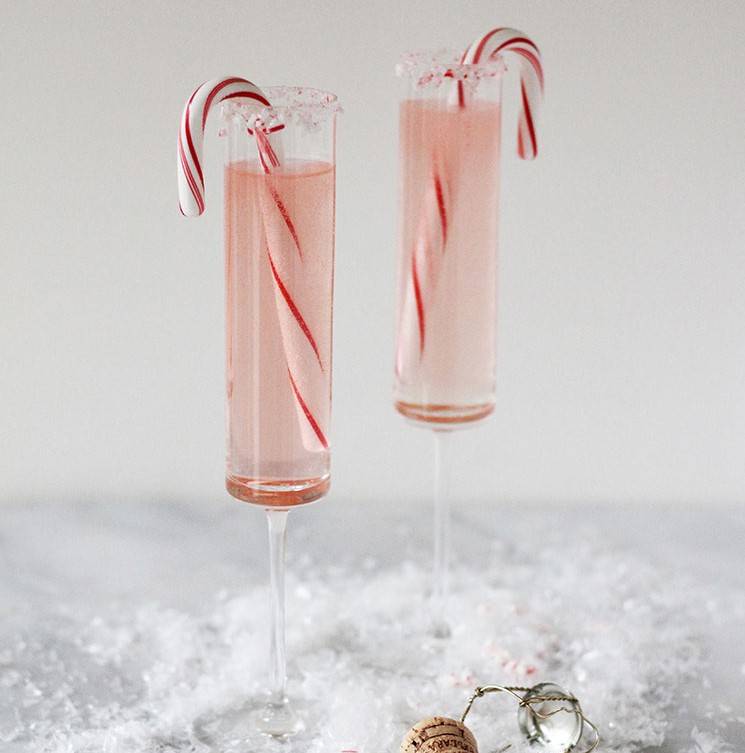 Peppermint champagne cocktail with candy canes inside