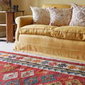 nomad summerhouse rug with yellow sofa
