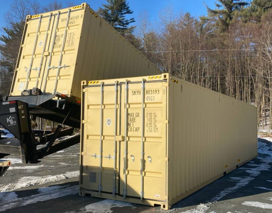 40 foot high cube shipping containers being unloaded