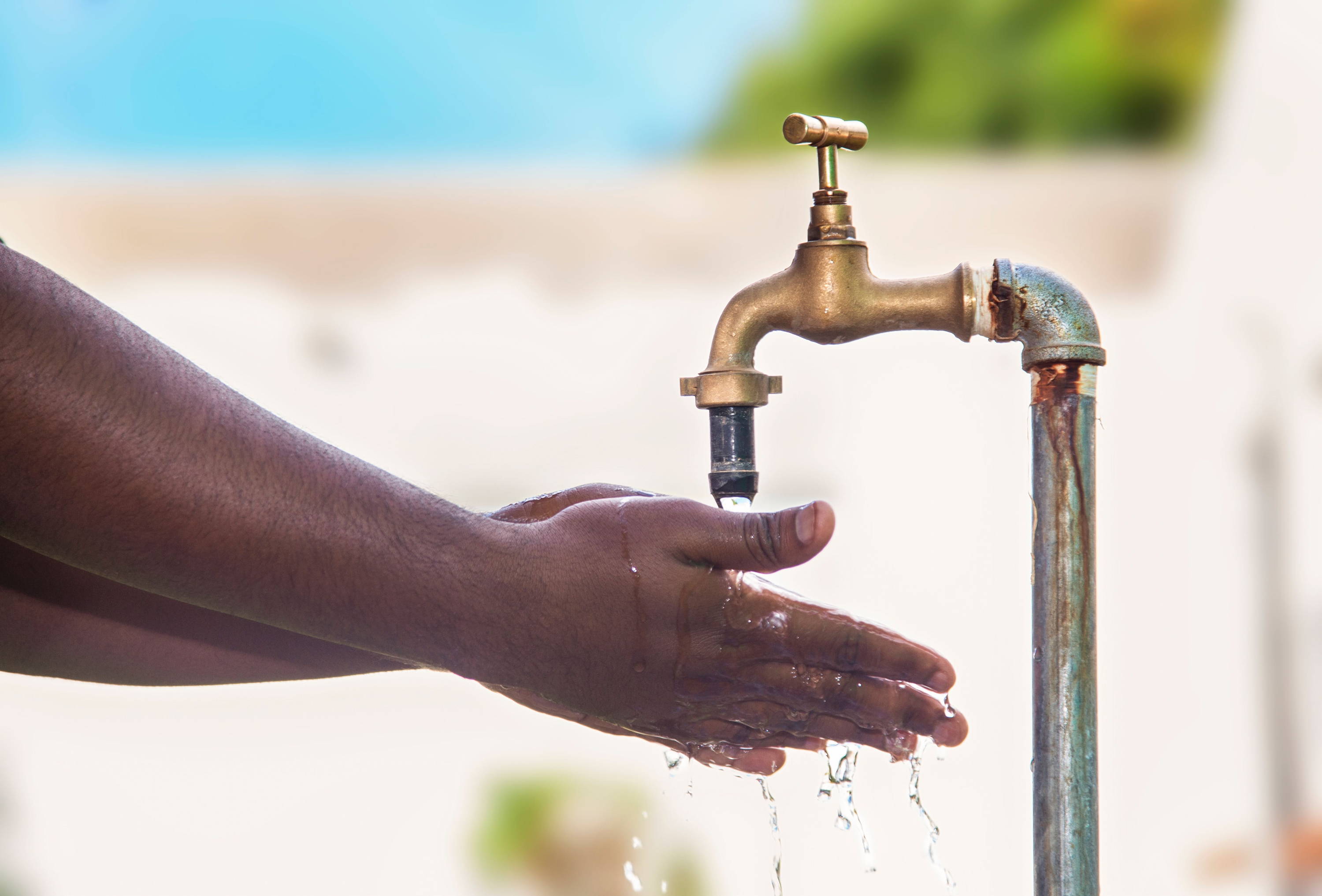 Hands with outdoor tap