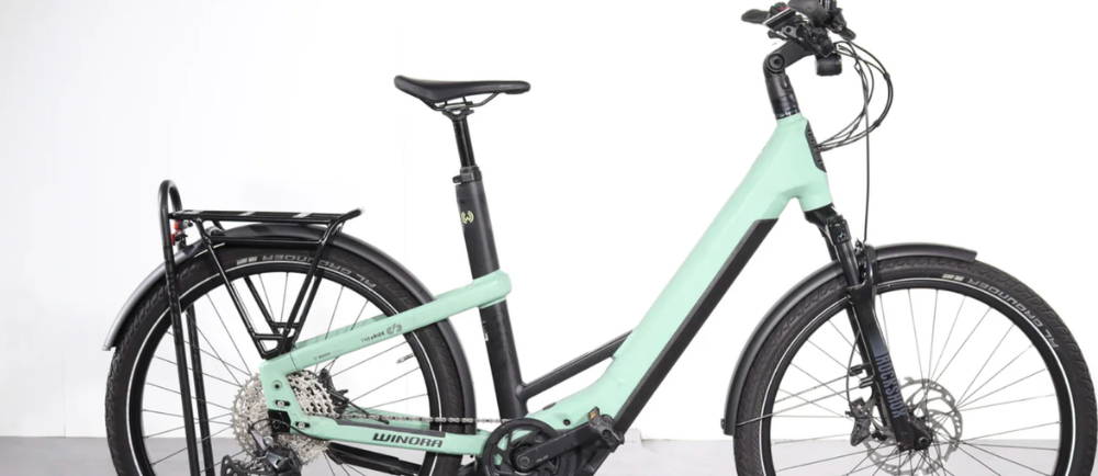 a light green Winora Yakun 12 low step electric city bike