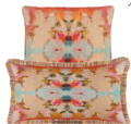 throw pillows in oranges, pinks and blues