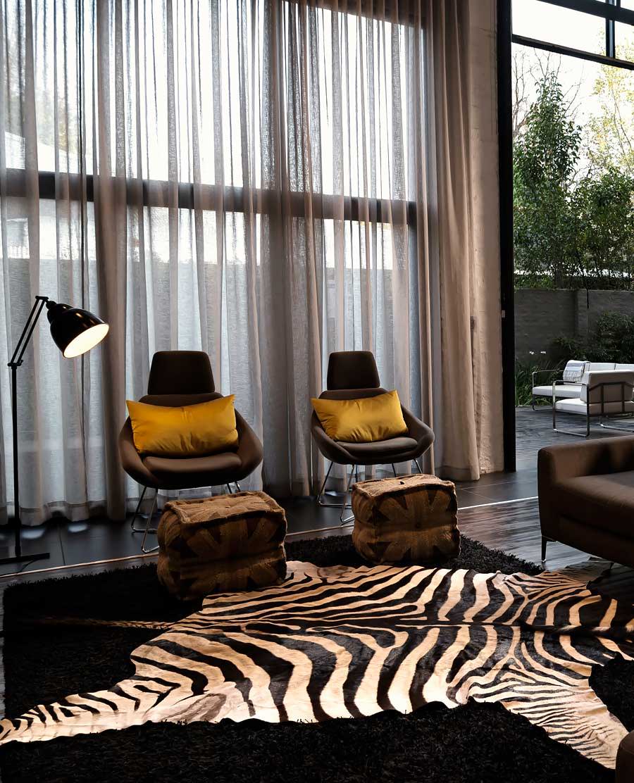 Zebra skin rug laying out on surface