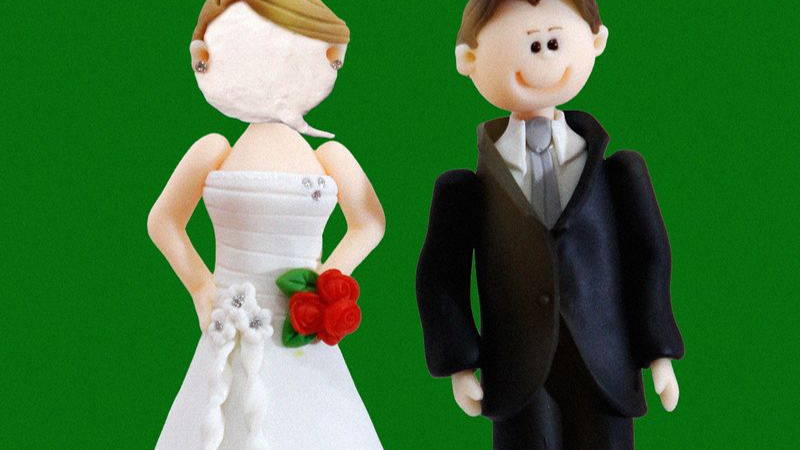 Image may contain: Figurine, Cake, Dessert, Food, Baby, Person, Adult, Wedding, Face, Head, Birthday Cake, and Cream
