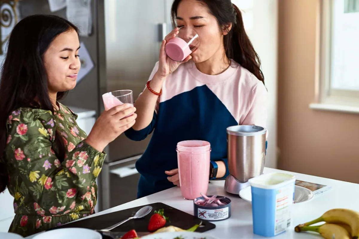 teen and mother drinking protein cocktail