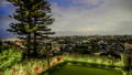 Garden illuminated with Garden Lighting by Havit, overlooking Sydney cityscape around dusk.