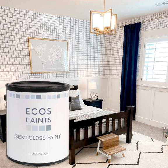 A can of Ecos Eggshell Paint superimposed in front of a contemporary kitchen