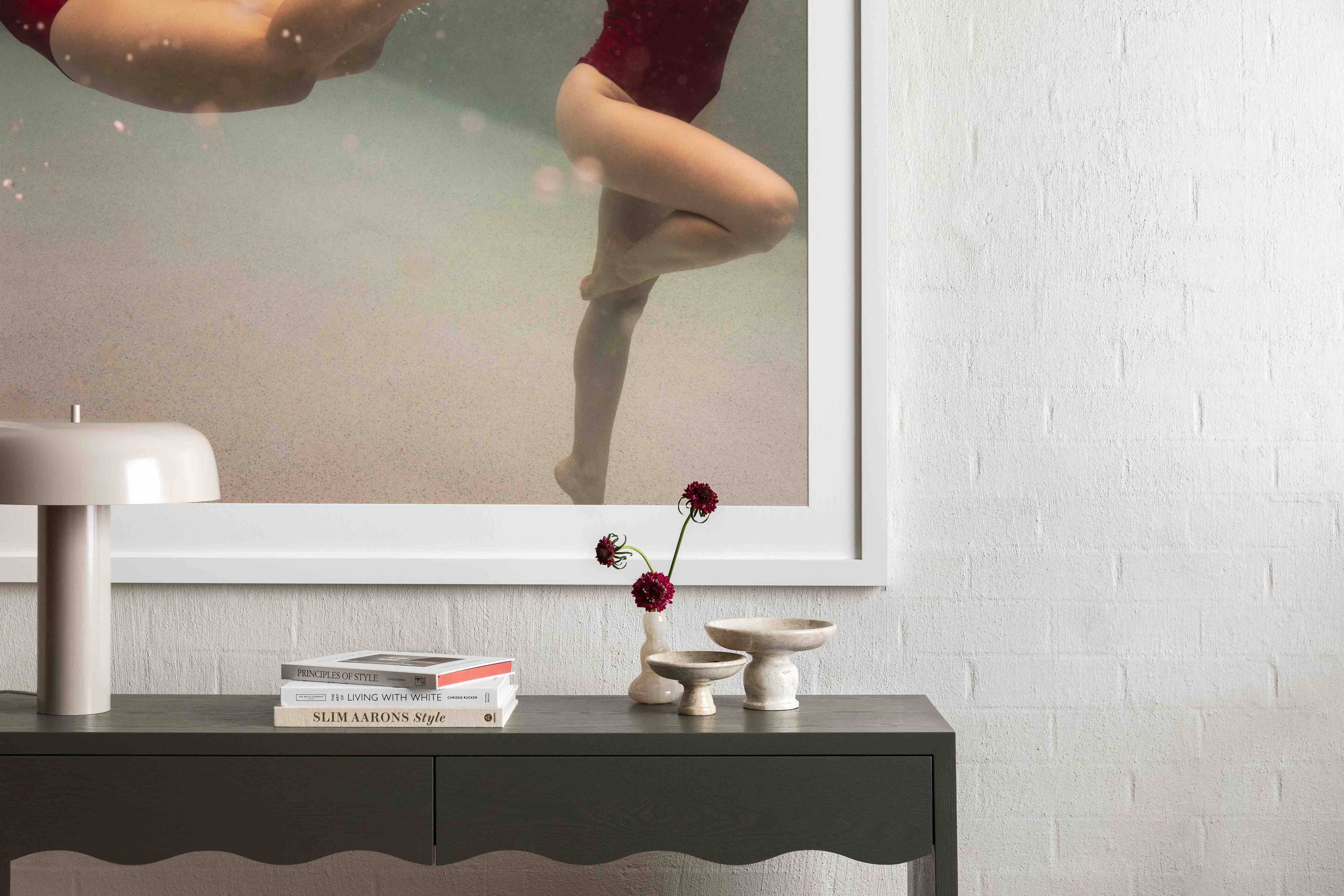 Opposites Attract 3 by Francesca Owen - Underwater photography of two synchronised swimmers wearing red swimsuits.