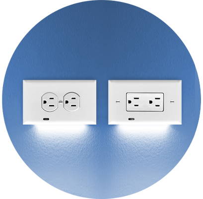Two GuideLight 2 outlet night lights on a blue wall