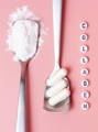 spoon of powdered collagen next to spoon of collagen capsules, the word collagen spelled out vertically with beads, on a pink background
