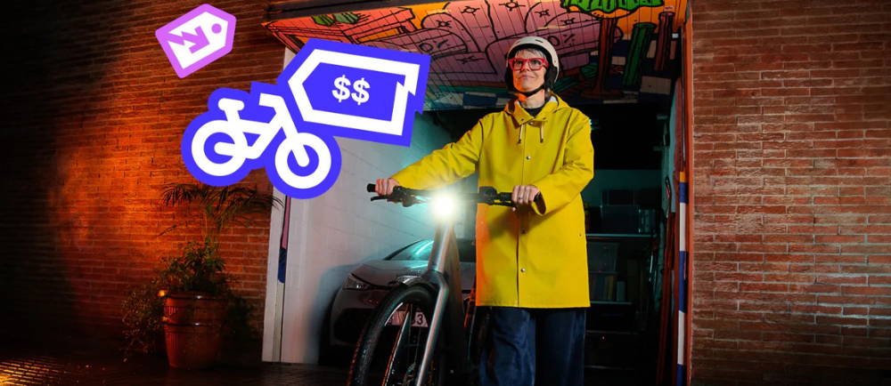 woman with yellow jacket walking electric bike