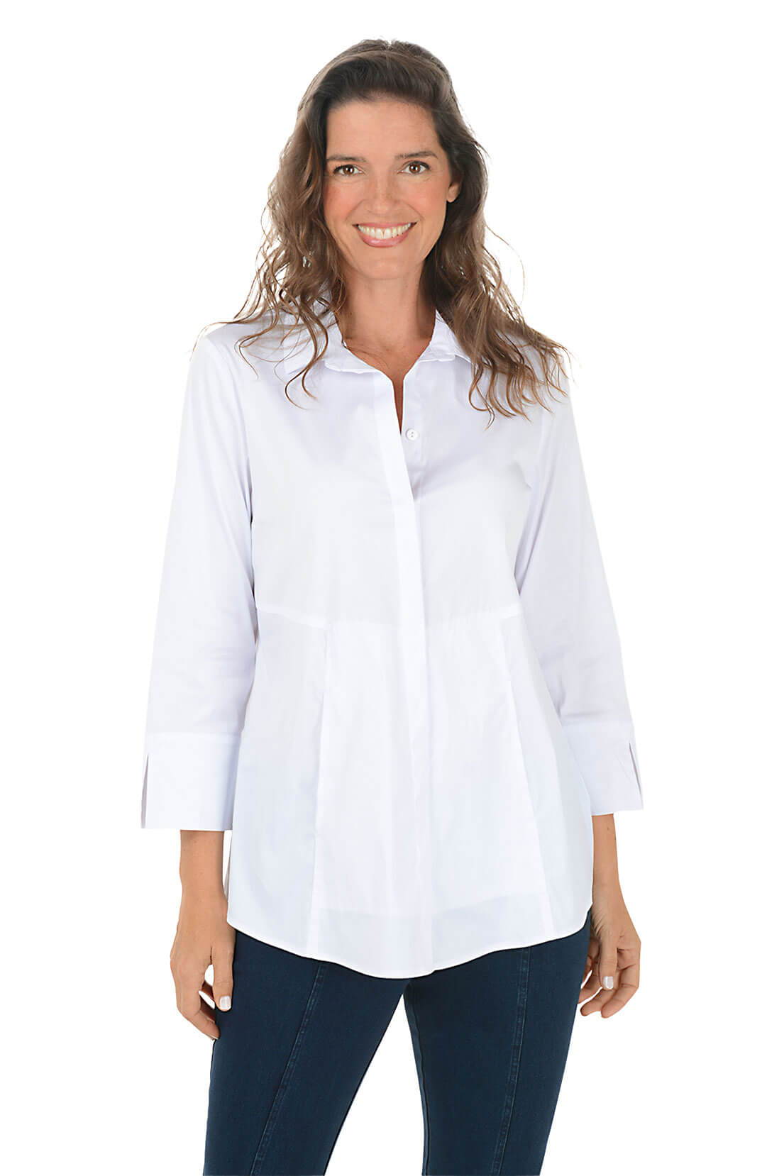 A woman wears a white tunic button-front shirt.