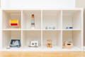 Montessori playroom shelf with toys. 