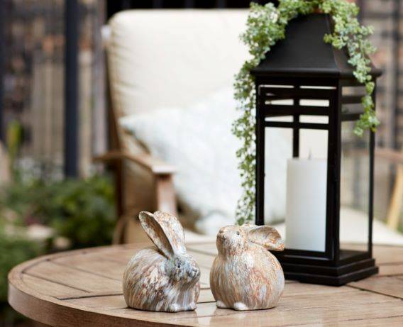 black lantern with small ceramic bunnies