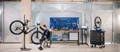 Upway mechanic refurbishing Cube electric bike in stand