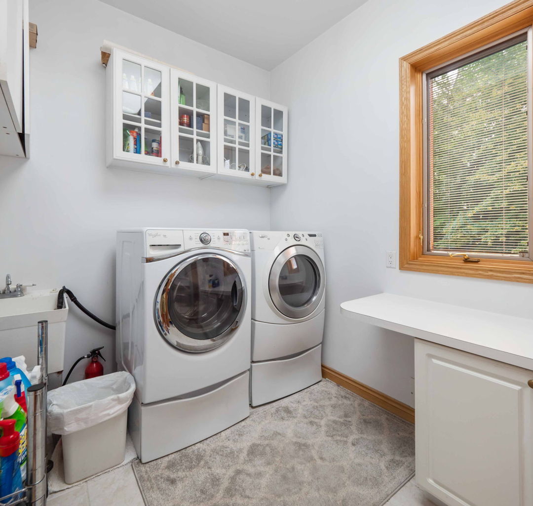 washroom with independent washer and dryer