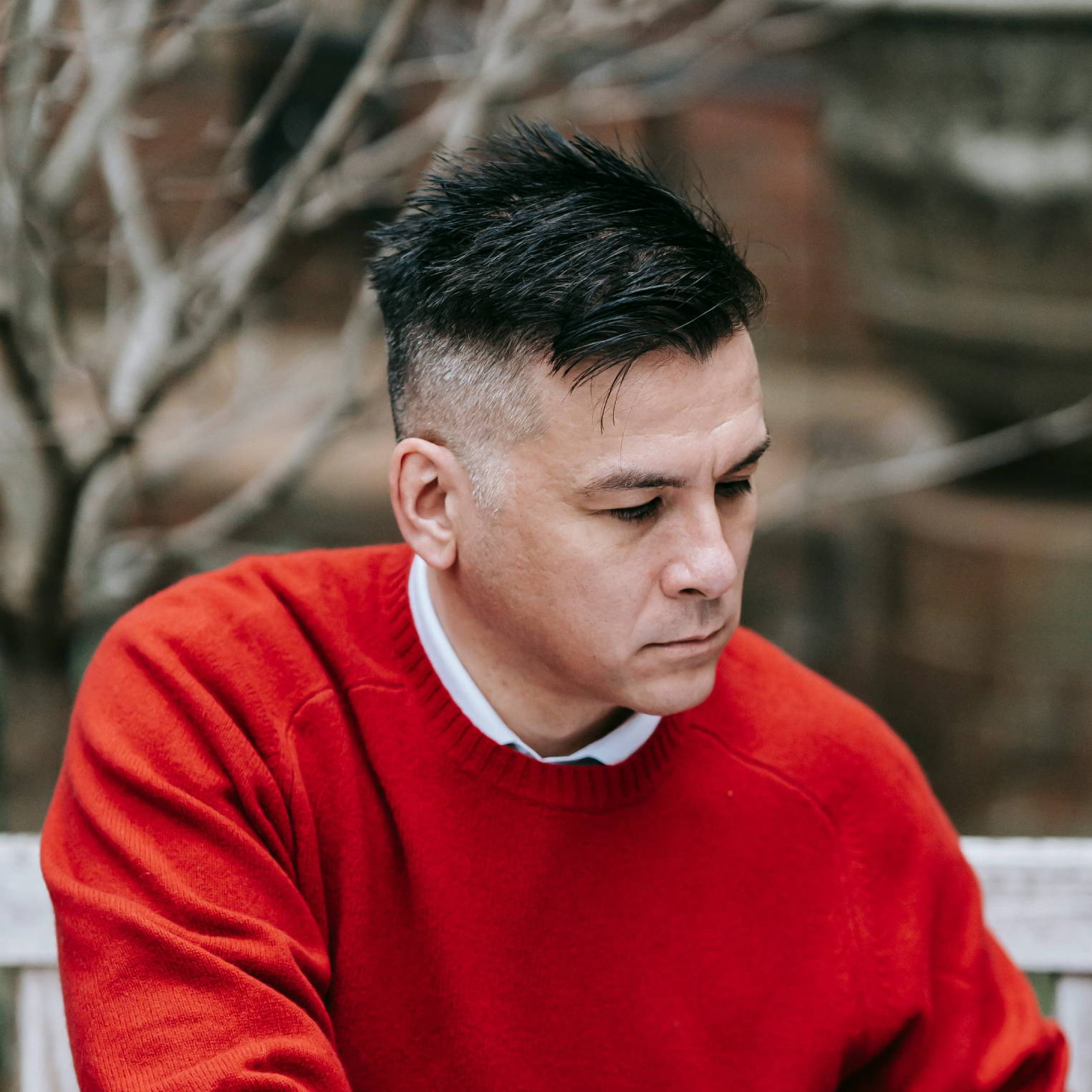man in red sweater with a flat-top haircut