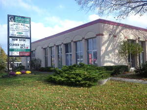 exterior view of the large physical storefront and road sign