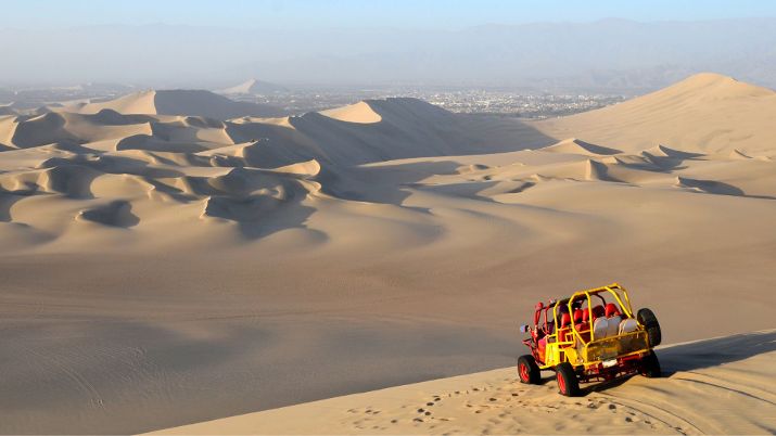 Nestled within the Ica Desert is the picturesque Huacachina oasis, a lagoon surrounded by towering sand dunes that attracts enthusiasts of sandboarding and dune buggying