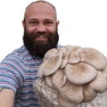 man holding mushroom kit