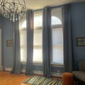 light blue velvet curtains with a beautiful puddle effect on the wood floor