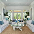 Image is of a living room with white St. Bart Sofas.