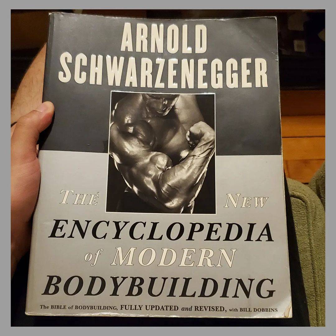 the new encyclopedia of modern bodybuilding book on table