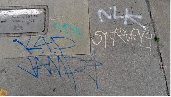 removing graffiti tags using bare brick stone and masonry graffiti remover