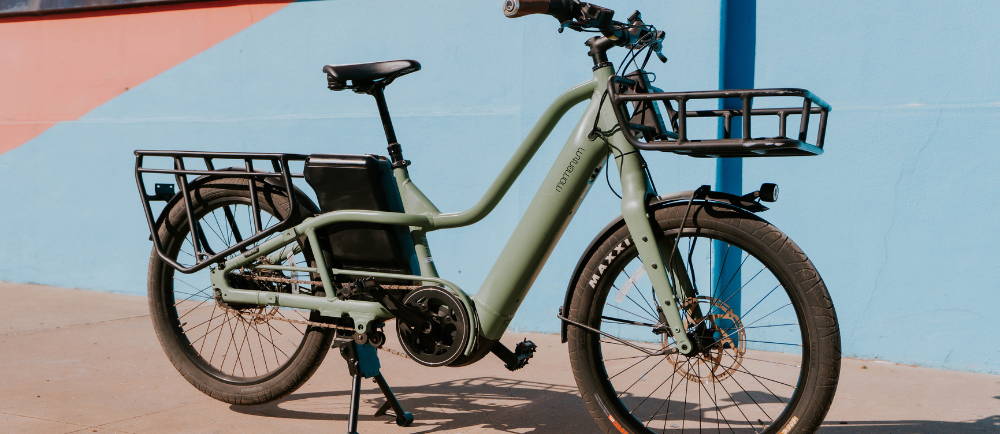 Momentum PakYak+ electric bike on sidewalk