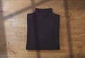 what is merino wool article with image showing a merino wool rolled collar sweater