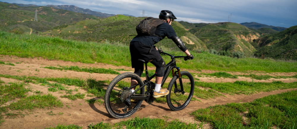 a man descending a trail in los angeles on an electric mountain bike