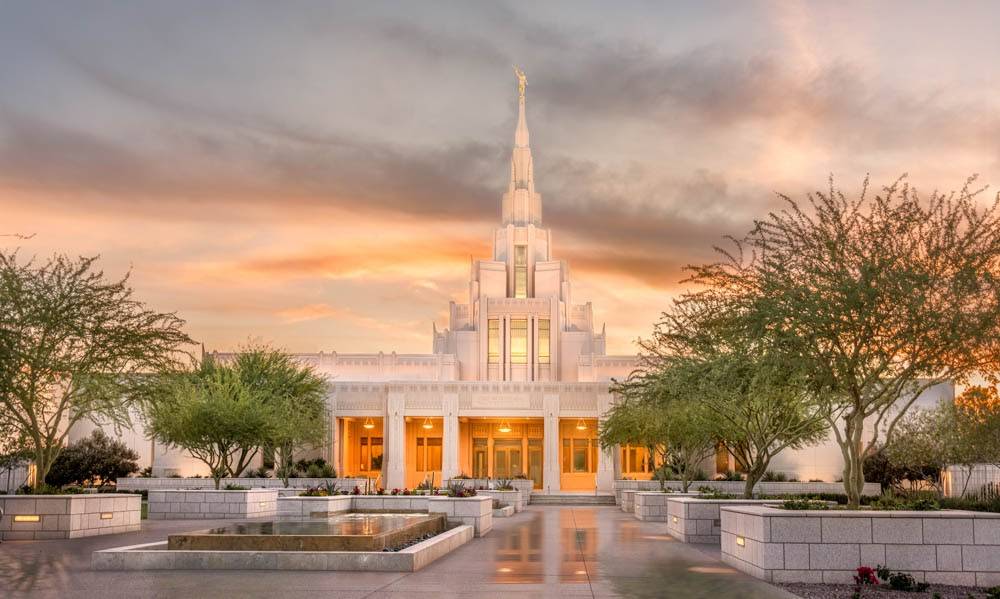 Phoenix Temple in front of orange and purple clouds.