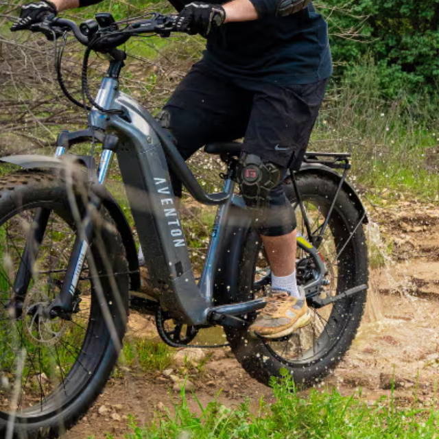 a person riding an aventon aventure fat tire electric bike